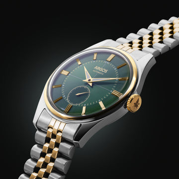 A refined olive green dial watch with a gold two-tone bracelet, crafted for understated luxury.