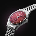 A refined take on red dial men's watch, pairing a deep wine-red dial with a clean silver finish.