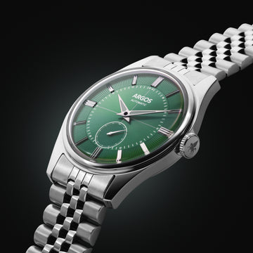 A refined silver watch with green dial, balancing modern elegance with everyday versatility.