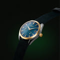 Olympus Azure blue men’s luxury watch with gold two tone case and leather strap by Argos.