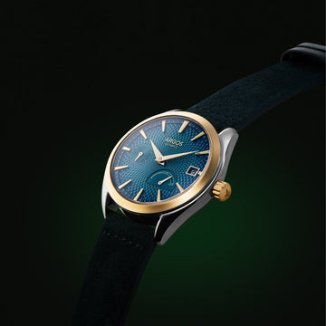 Olympus Azure blue men’s luxury watch with gold two tone case and leather strap by Argos.